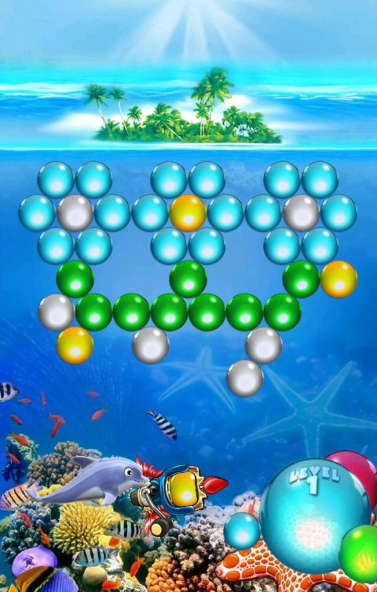 Дельфин убирает с экрана разноцветные шарики. Дельфин убирает с экрана разноцветные шарики. Фото.