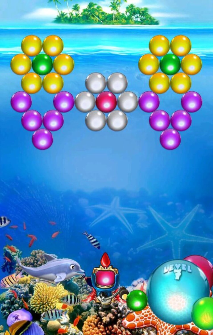 Дельфин убирает с экрана разноцветные шарики. Дельфин убирает с экрана разноцветные шарики. Фото.