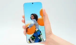 TECNO concept smartphone with a truly bezel-less display, screen extending fully to the edges of the chassis, held in hand